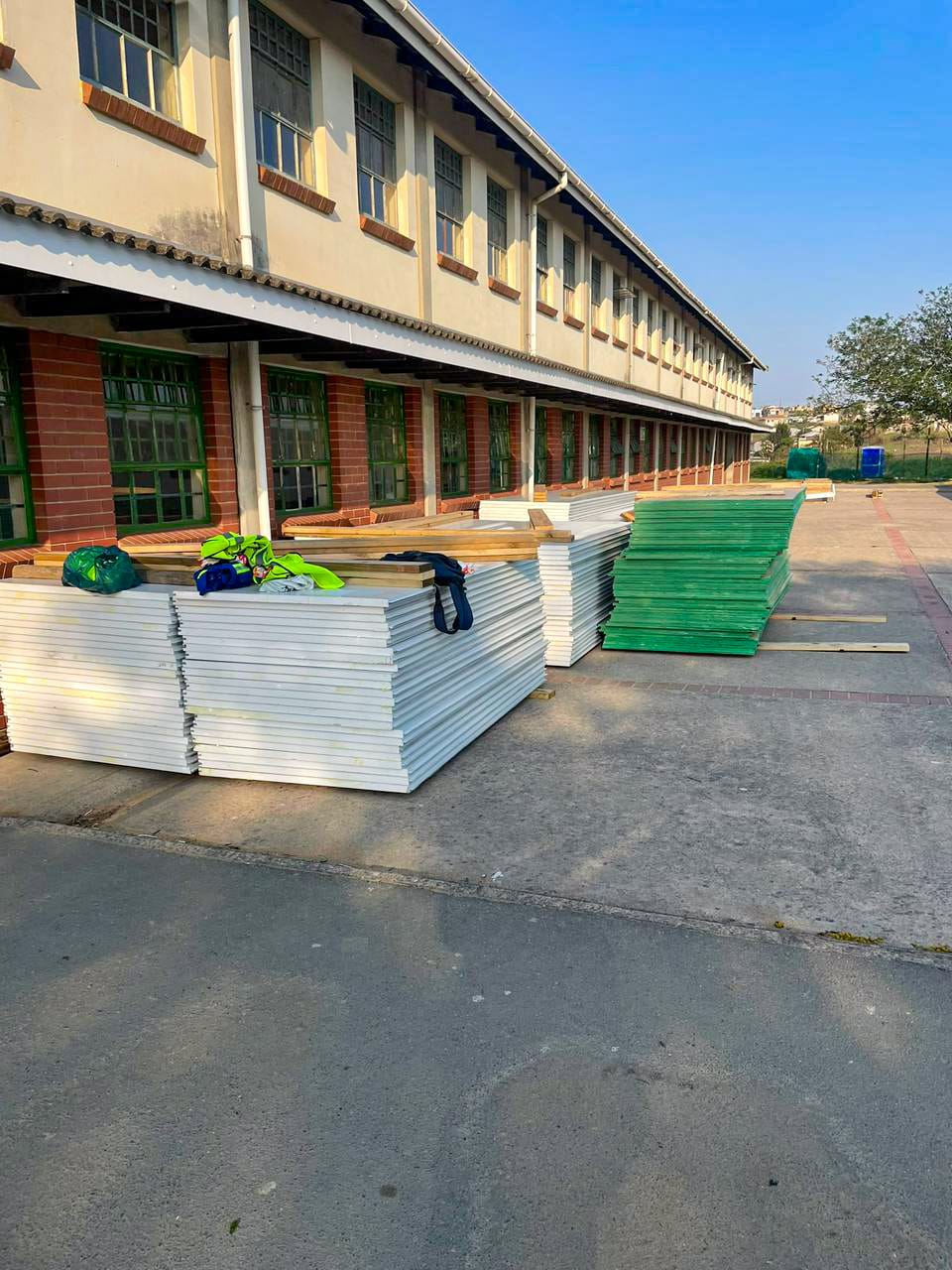 School renovation exterior painting showing fresh coat of paint on building walls